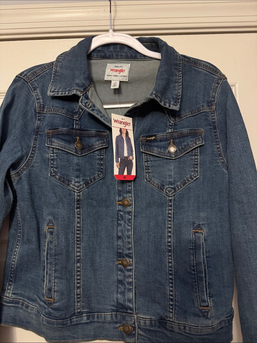 NWT Wrangler Women’s Denim Blue Jacket-size Medium. In brand new condition.